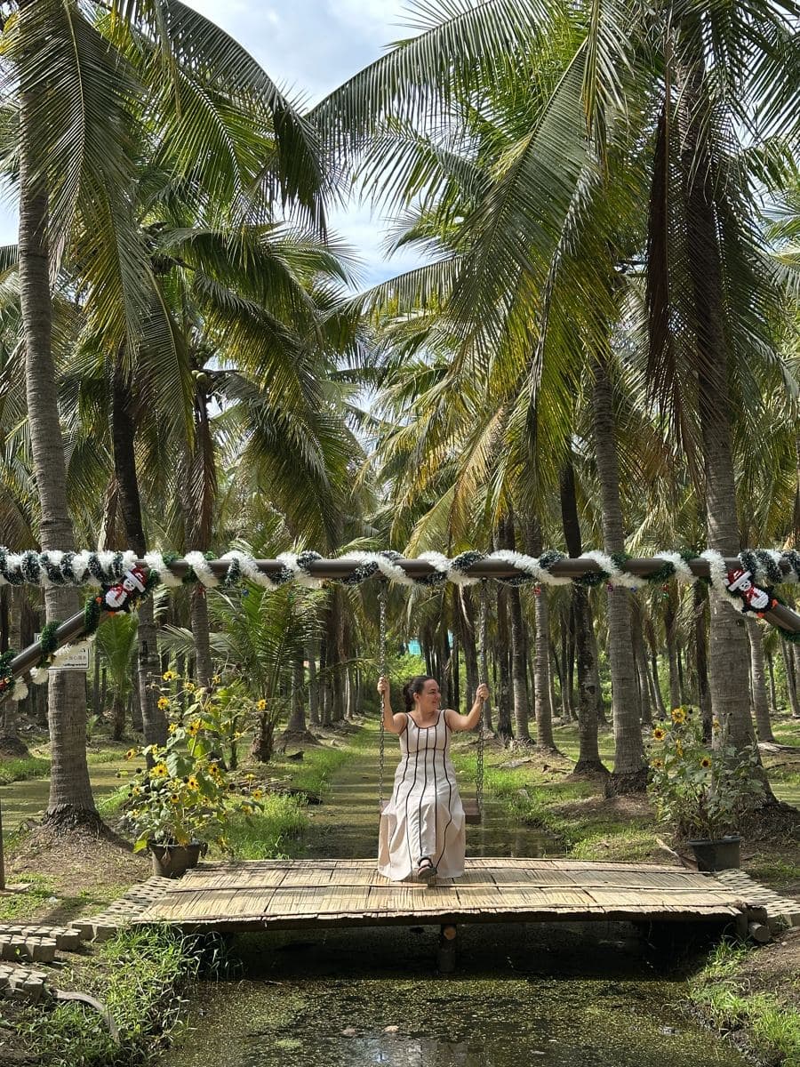 Valeria on the swing in the coconut grove