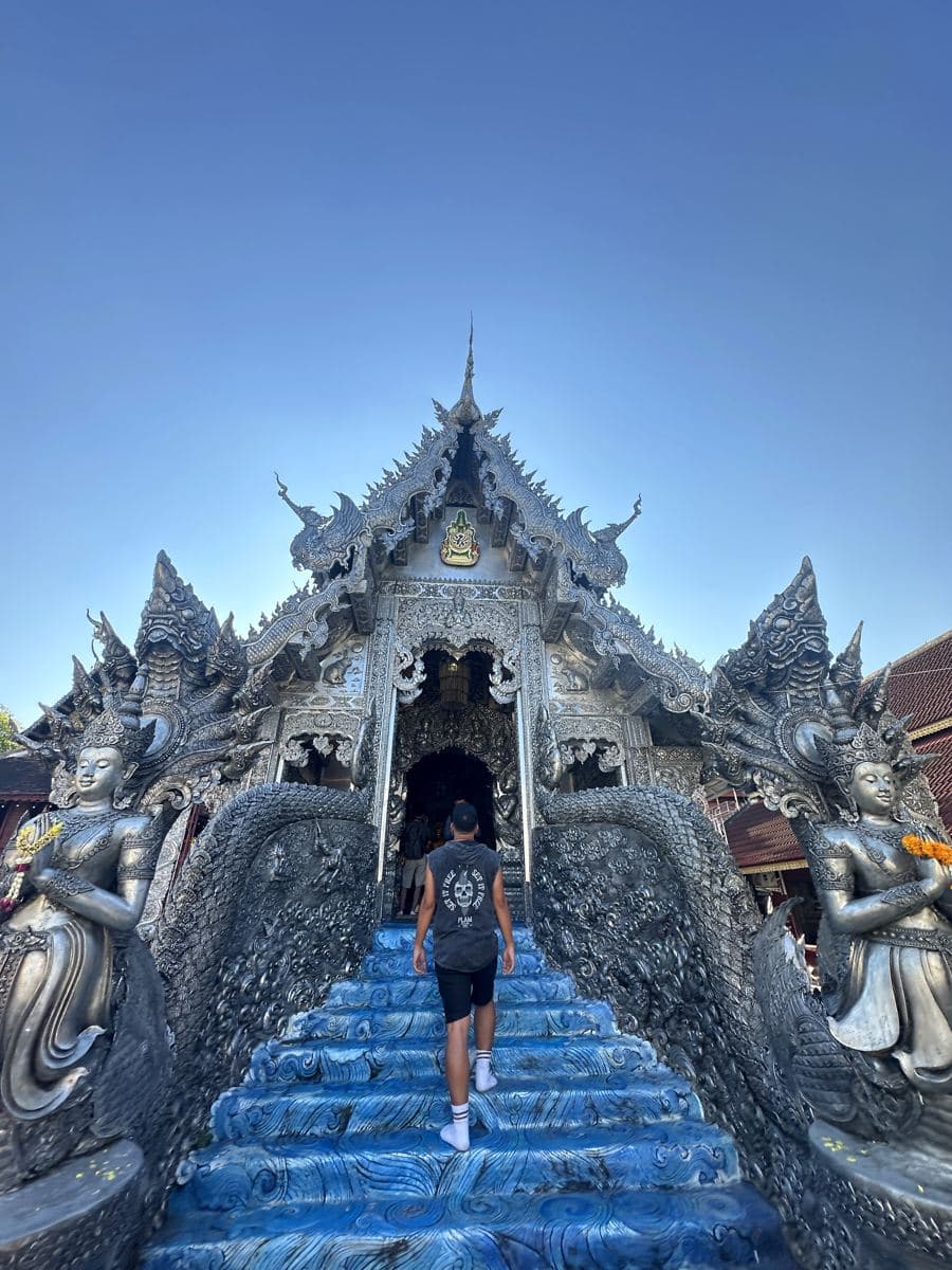 Arni climbing the blue naga staircase of the Silver Temple